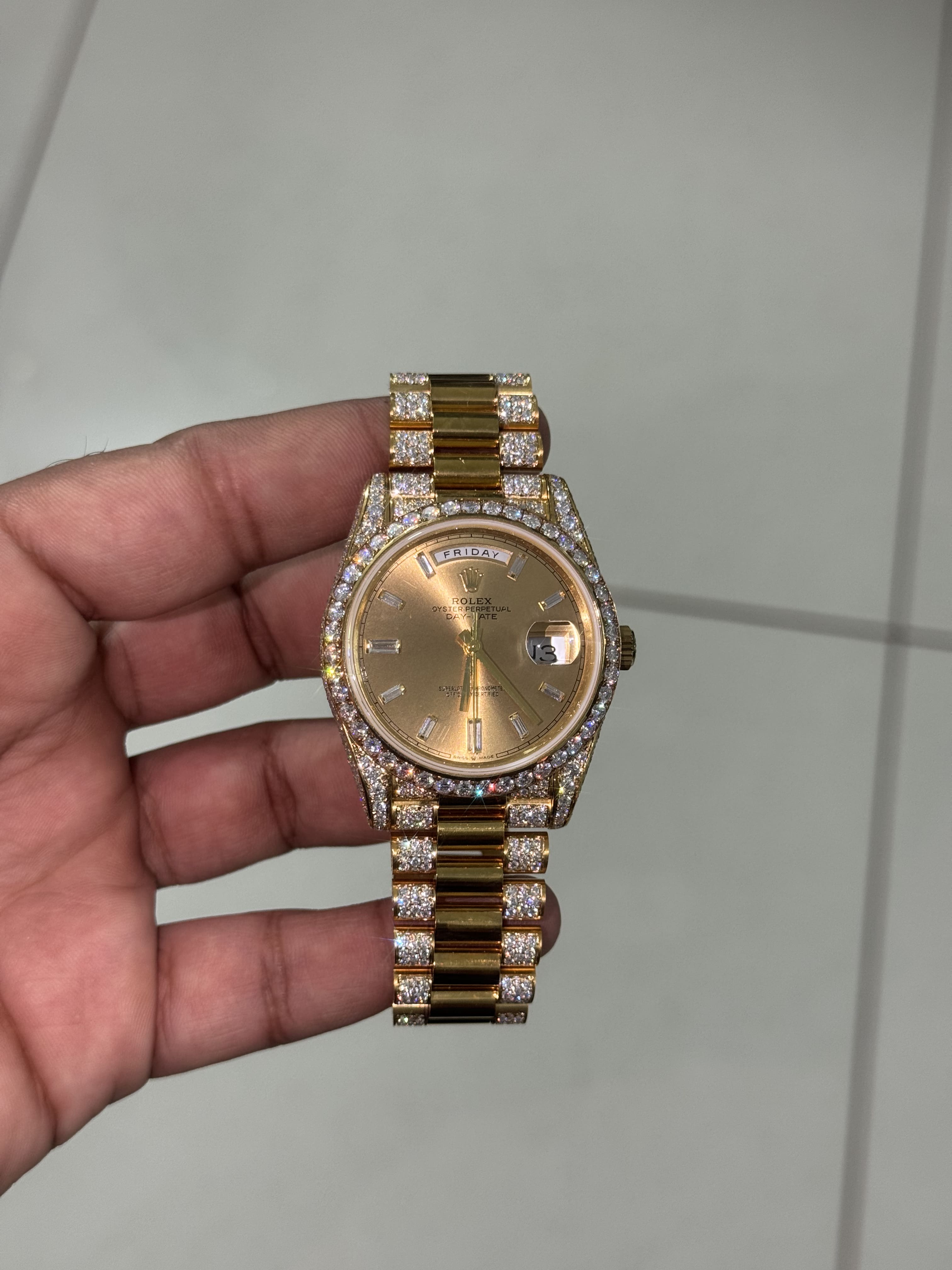 Yellow Gold Moissanite Rolex Day-Date with round diamond dial and smooth center links